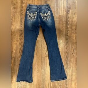 Elegant Dark Blue Flare Jeans with Embroidered Pockets
